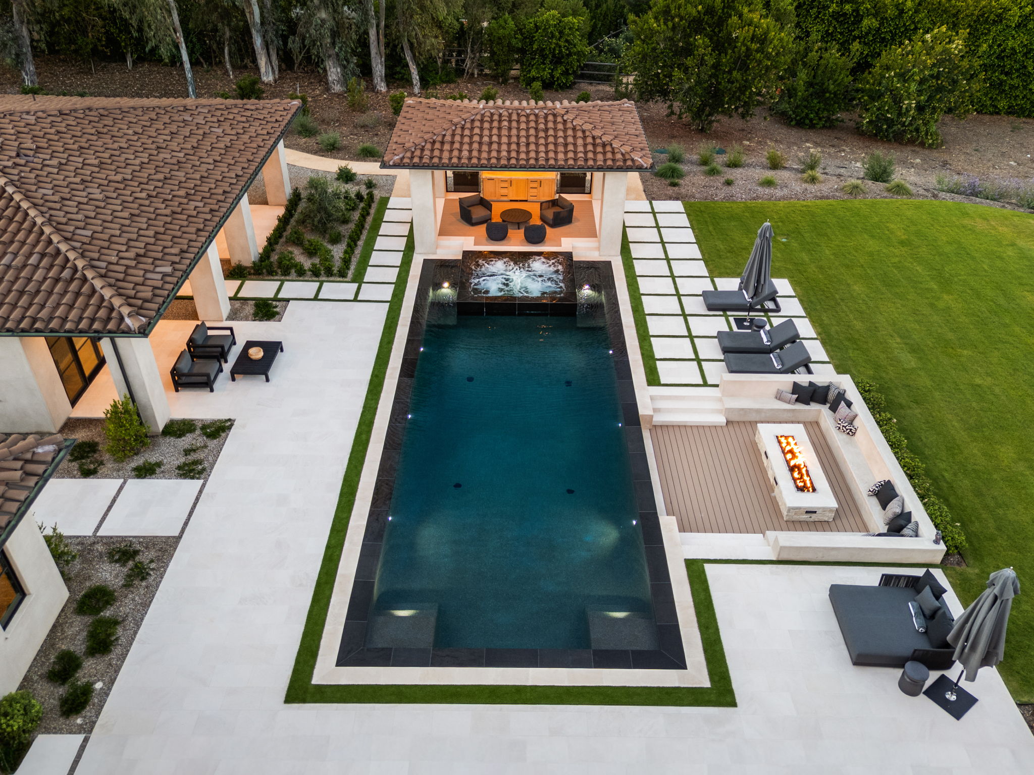 Aerial view of a luxury estate pool with cabana and fire feature — San Diego drone photography by YonoPro