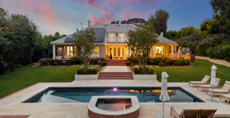 Luxury San Diego estate at twilight — infinity pool, lit pavilion, firepit terrace shot by YonoPro